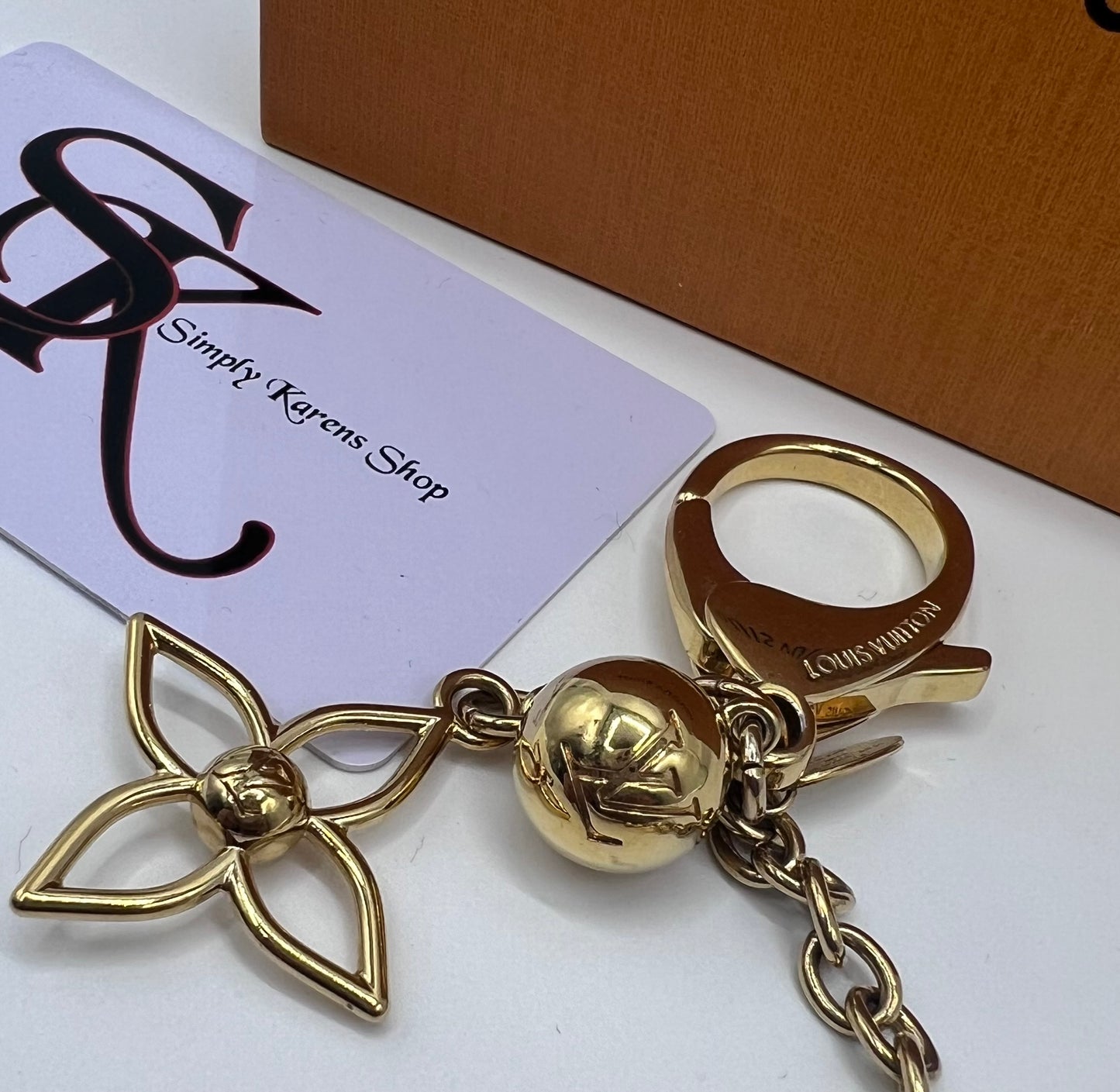 LV BLOOMY GOLD PLATED BAG CHARM