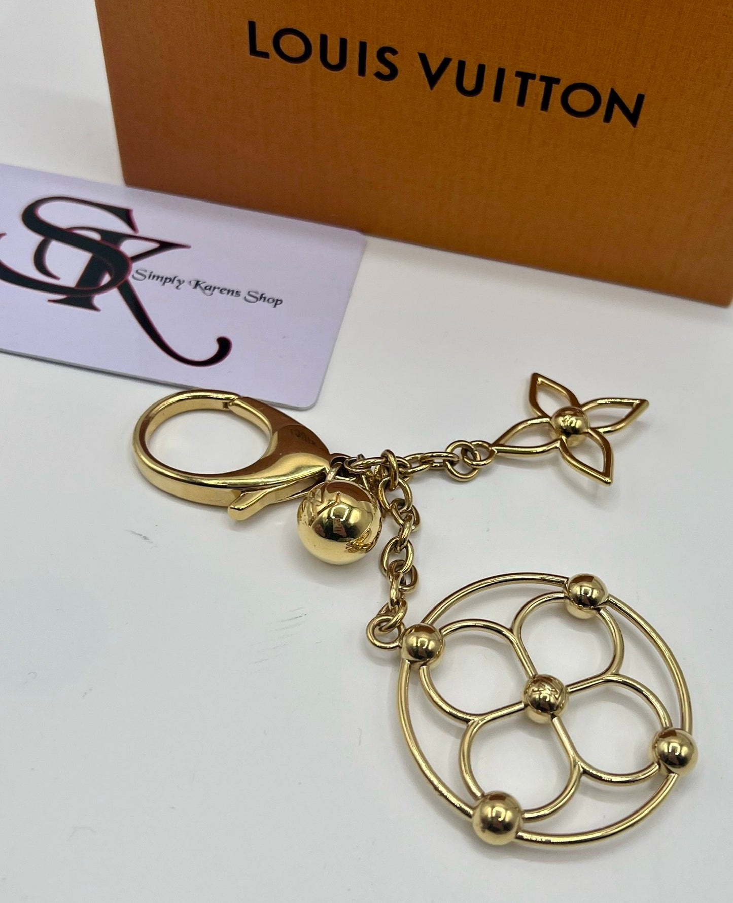 LV BLOOMY GOLD PLATED BAG CHARM